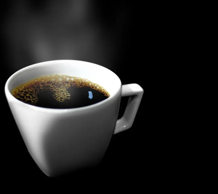 Cup of coffee with Smile Brilliant Teeth Whitening  